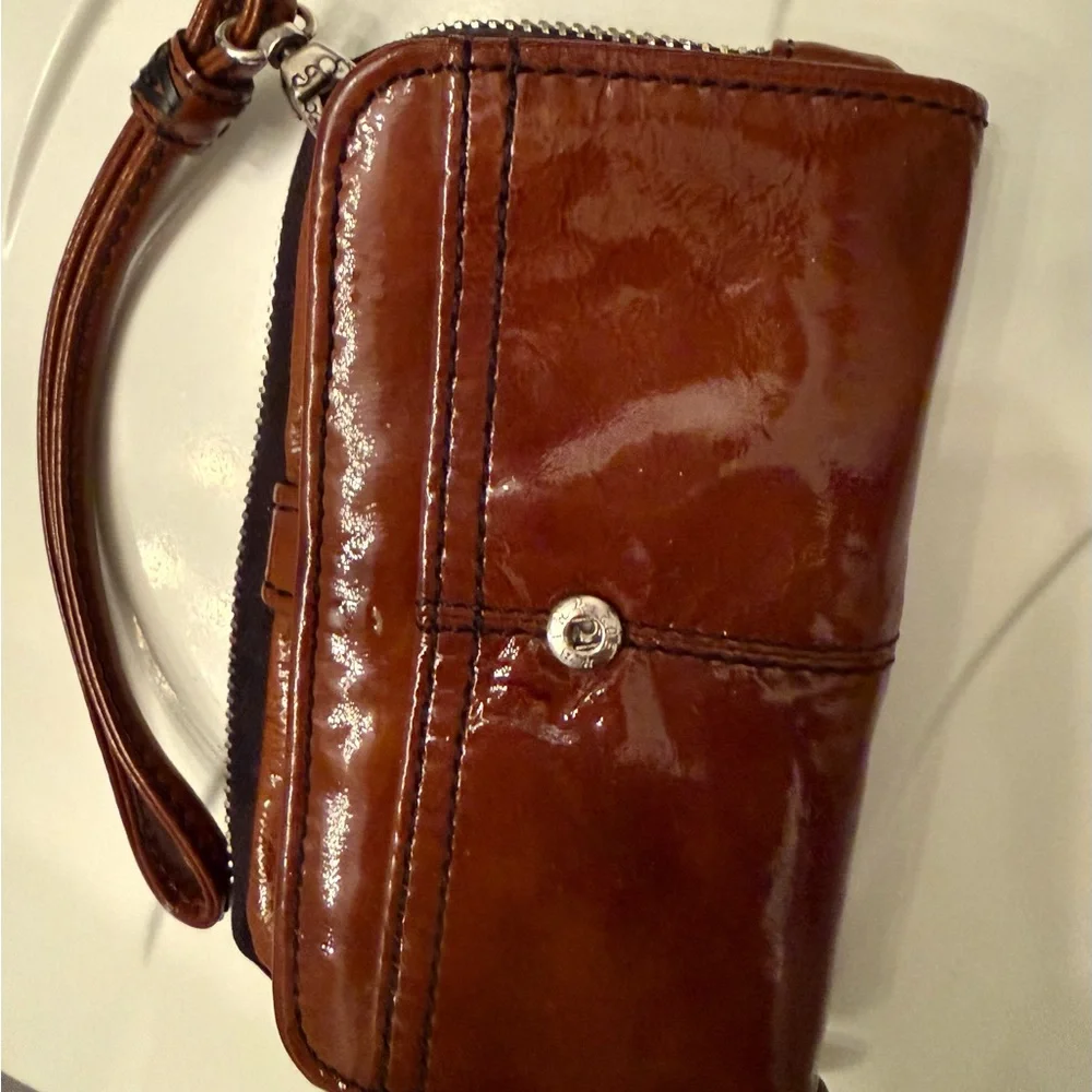 Brighton Shiny patent leather Brown Wristlet with Silver Emblem